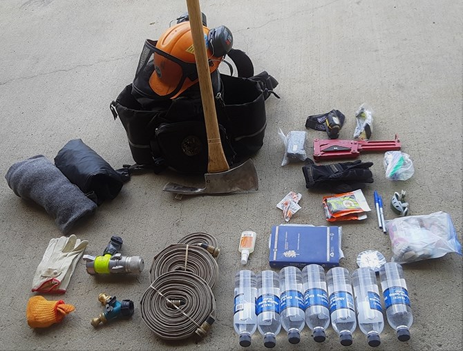 Some of the possible contents of a wildfire firefighter's backpack.