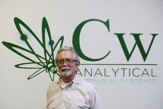 In this Friday, Aug. 16, 2019, photo, Robert Martin, co-founder and CEO of CW Analytical Laboratories, poses for photos while being interviewed at his office in Oakland, Calif. Chemists are trying to solve a scientific mystery involving marijuana brownies. Chocolate seems to throw off test results for potency. That could be dangerous for consumers looking to relax, not hallucinate. 