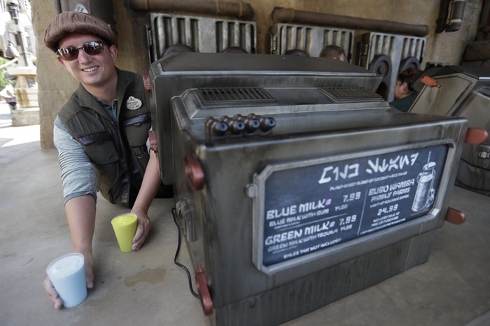 Blue Milk and Green Milk are among the refreshments for sale to guests during a preview of the Star Wars themed land, Galaxy's Edge in Hollywood Studios at Disney World, Tuesday, Aug. 27, 2019, in Lake Buena Vista, Fla. The attraction will open Thursday to park guests. 