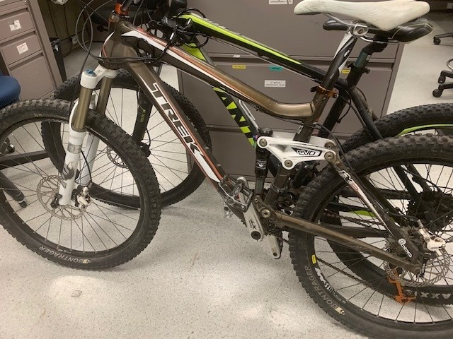 Side view of a brown and white TREK bike.