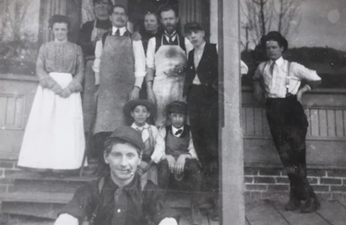 This photo shows some of the Inland Cigar Factory employees. The presence of two young boys and a woman has raised some questions, according to notes from the Kamloops Museum and Archives. 
