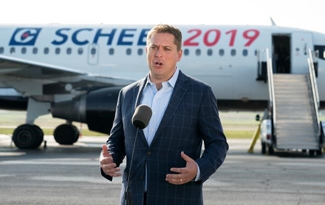 Conservative Leader Andrew Scheer talks with reporters prior to boarding his campaign plane in Ottawa on Wednesday, September 11, 2019. 