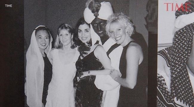 A photo showing Prime Minister Justin Trudeau, second from right, at a 2001 costume party - his hands and face blackened with makeup -- was published by Time Magazine Wednesday. They say it was published in the yearbook from the West Point Grey Academy, a private school in Vancouver, B.C., where Trudeau worked as a teacher before entering politics. 