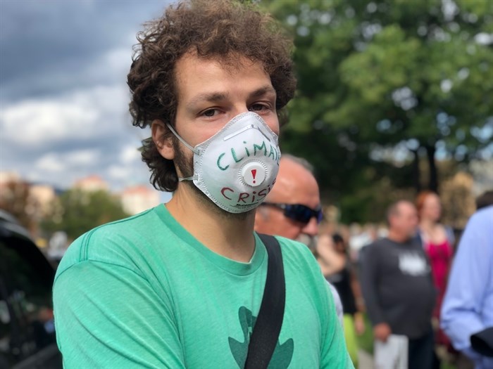 A protestor at Kelowna's Global Climate Strike rally wore a symbolic mask. 