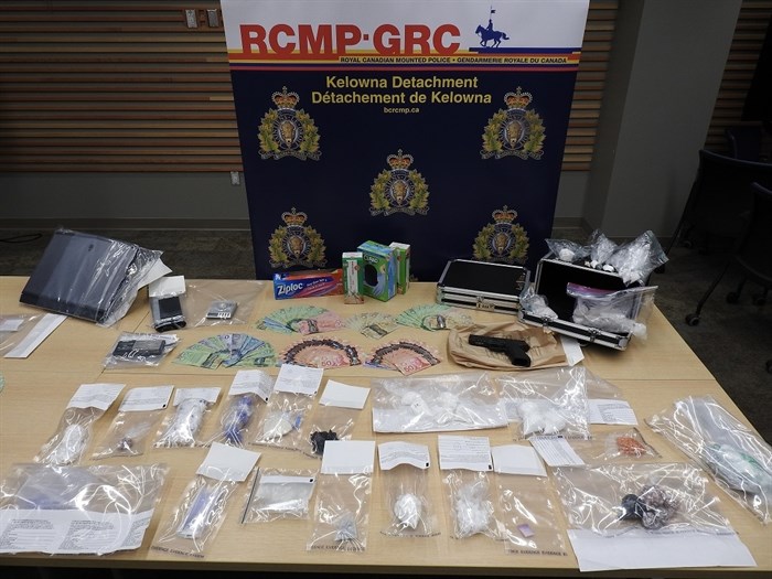 Drugs, a handgun and cash seized during RCMP raids in Kelowna on Sept. 19, 2019.