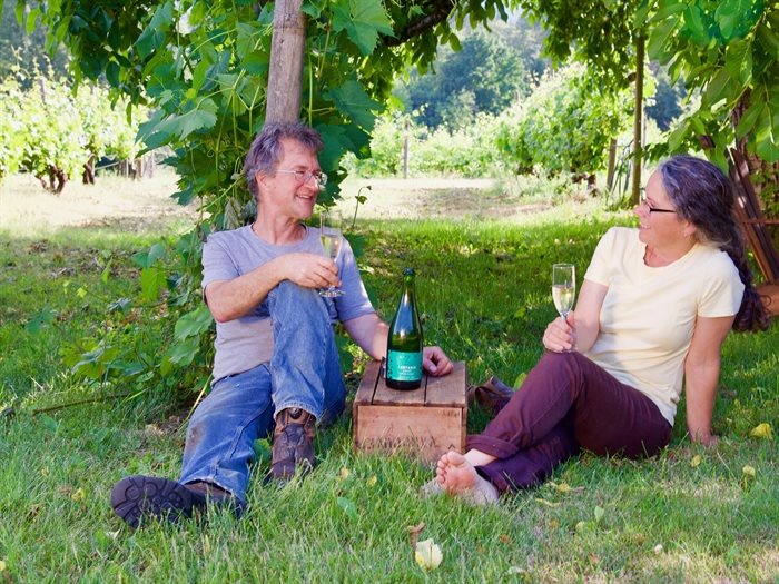 Vigneti Zanatta Winery owners Jim Moody and Loretta Zanatta taking a break in their vineyard after a long day.