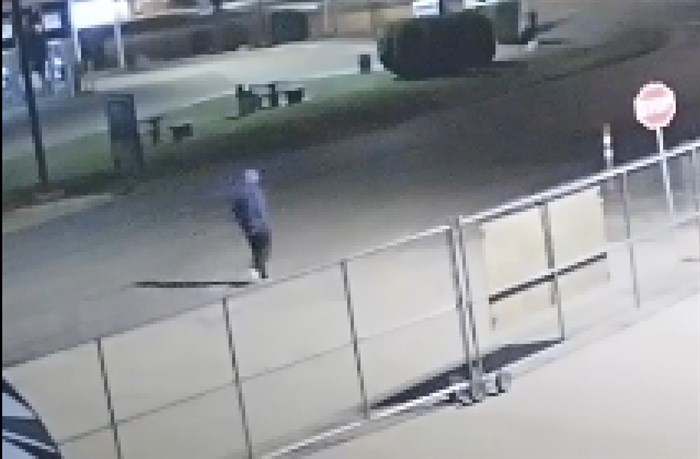 Video surveillance shows a man in a blue hoodie walking towards the motorhome in the early morning of Sept. 21, 2019. 