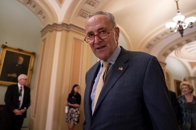 Senate Minority Leader Chuck Schumer, D-N.Y., arrives to speak to reporters at a news conference at the Capitol in Washington, Tuesday, Sept. 17, 2019.