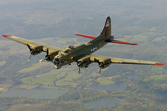 FILE - In this April 2, 2002, file photo, the Nine-O-Nine, a Collings Foundation B-17 Flying Fortress, flies over Thomasville, Ala., during its journey from Decatur, Ala., to Mobile, Ala. A B-17 vintage World War II-era bomber plane crashed Wednesday, Oct. 2, 2019, just outside New England's second-busiest airport, and a fire-and-rescue operation was underway, official said. Airport officials said the plane was associated with the Collings Foundation, an educational group that brought its 