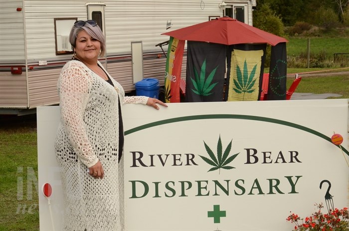 River Johnson stands outside the cannabis store she opened in August.