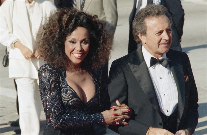 FILE - This Sept. 21, 1986 file photo shows singers Vic Damone, right, and Diahann Carroll at the Emmy awards in Los Angeles. Carroll died, Friday, Oct. 4, 2019, at her home in Los Angeles after a long bout with cancer. She was 84. 