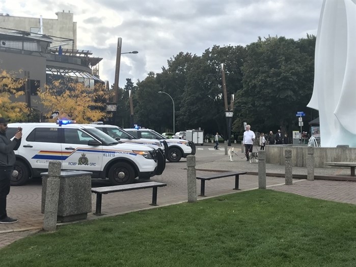 RCMP officers respond to reports of a man waving a hunting knife on the waterfront in downtown Kelowna, Friday, Oct. 4, 2019.