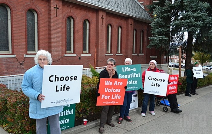 Tonia Howell, left, and Kathy Dahl, second from left, are joined by churchgoers from various congregations across Kamloops for their Choose Life 40 Day Prayer Vigil.