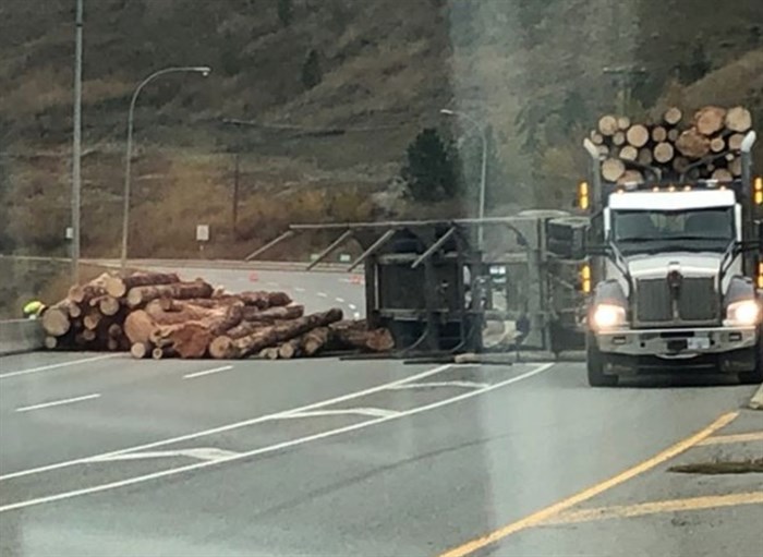 A logging truck is pictured with it's haul partially blocking Highway 5 on Tuesday, Oct. 15, 2019.