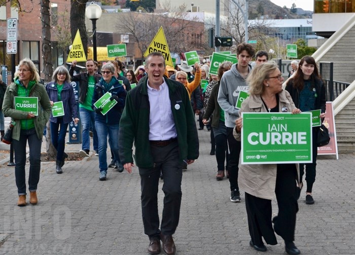 Kamloops-Thompson-Cariboo Green Party candidate Iain Currie, left, and leader Elizabeth May marched with a group of supporters through downtown Kamloops during a campaign stop, Tuesday, Oct.15, 2019.
