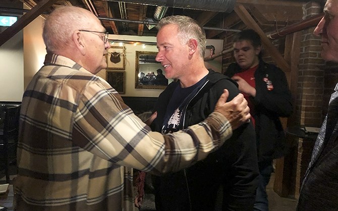 Liberal Stephen Fuhr is consoled by a supporter after Conservative Tracy Gray took the Kelowna-Lake Country riding.