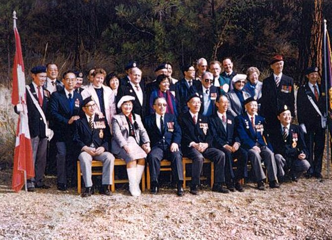 Former Chinese Canadian soldiers and dignitaries pose for a photo while dedicating Commando Bay on Okanagan Lake in September, 1988.