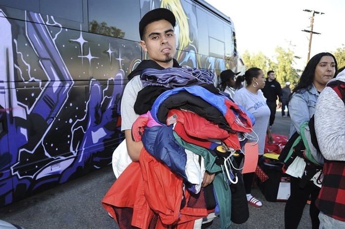 Justin Quintna, of Los Angeles, shops at Chris Brown's yard sale at Brown's home in the Tarzana neighborhood of the San Fernando Valley on Wednesday, Nov. 6, 2019, in Los Angeles. 