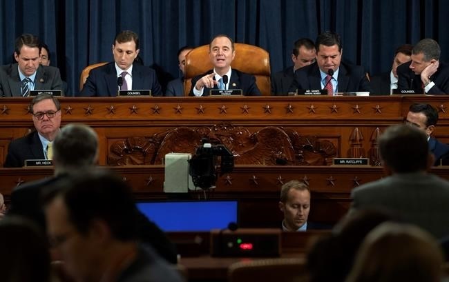 House Intelligence Committee Chairman Adam Schiff of Calif., center, speaks during the House Intelligence Committee on Capitol Hill in Washington, Wednesday, Nov. 13, 2019, in the first public impeachment hearing of President Donald Trump's efforts to tie U.S. aid for Ukraine to investigations of his political opponents.