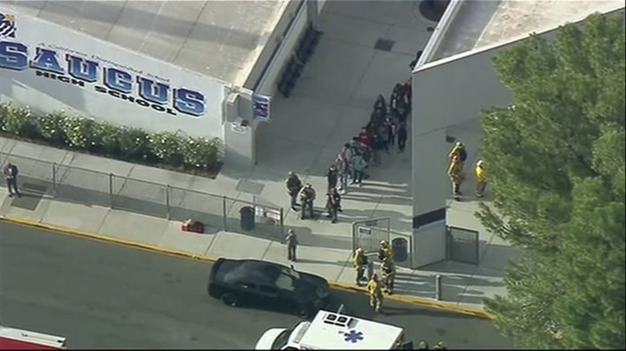 People are lead out of Saugus High School after reports of a shooting on Thursday, Nov. 14, 2019, in Santa Clarita, Calif. 