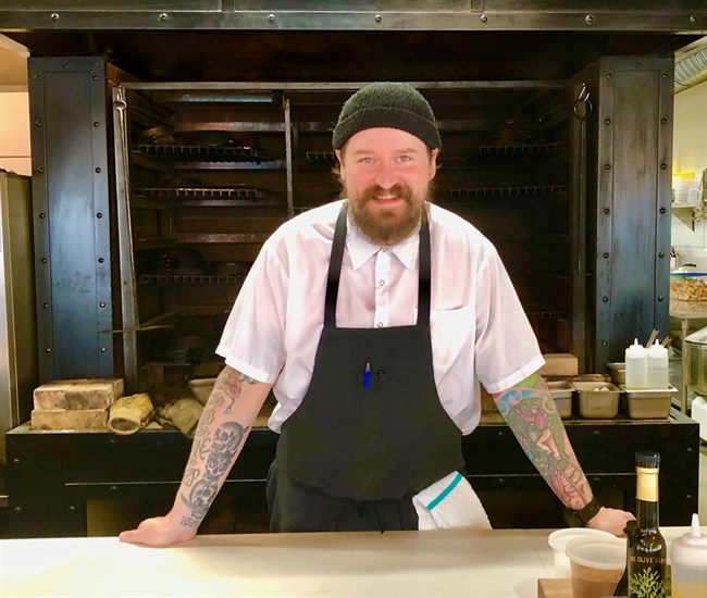 Chef Derek Gray is the man behind the pans (and in front of the fire) at Row Fourteen restaurant.