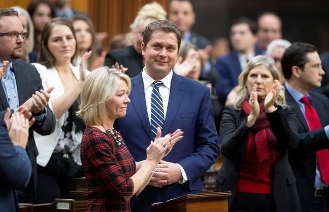 Leader of the Opposition Andrew Scheer is applauded by caucus members as he announces he will step down as leader of the Conservatives, Thursday, December 12, 2019, in the House of Commons in Ottawa.