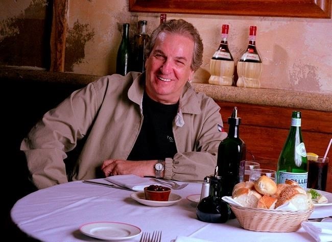 FILE - In this July 28, 2001 file photo, Danny Aiello poses for a photo at Gigino restaurant in New York. Aiello, the blue-collar character actor whose long career playing tough guys included roles in “Fort Apache, the Bronx,” 