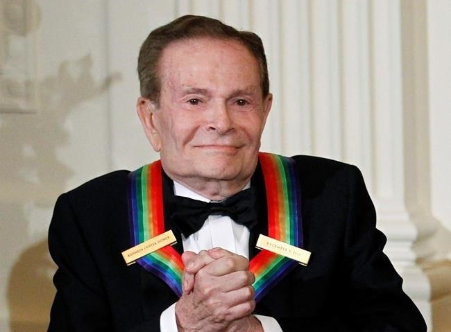 FILE - In this Dec. 5, 2010, file photo, composer Jerry Herman, one of the recipients of the 2010 Kennedy Center Honors is introduced during a reception in the East Room of the White House in Washington. Herman, the Tony Award-winning composer behind 