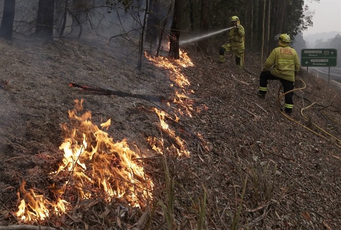Firefighters manage a controlled burn to help contain a larger fire near Falls Creek, Australia, Sunday, Jan. 5, 2020. The deadly wildfires, which have been raging since September, have already burned about 5 million hectares (12.35 million acres) of land and destroyed more than 1,500 homes. 