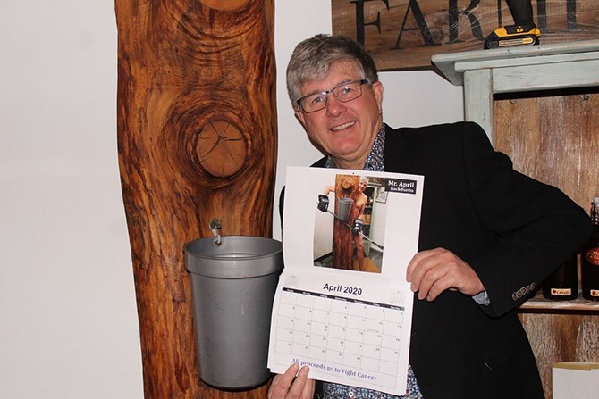  Roch Fortin a.k.a. Mr. April, (shown), with a copy of the Summerland Golden Jets calendar.