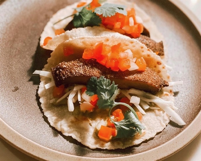 The Orchard Room's Vegan spiced mushroom tacos • with roasted portobello mushrooms, jalapeño crema, pico de gallo on a house made tortilla. 