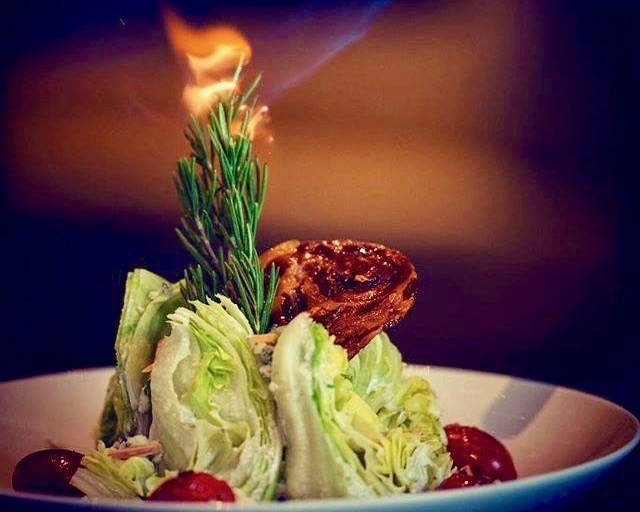 Atlas Steak +Fish in Kamloops Dine Around menu includes this dramatic Wedge Salad en flambe