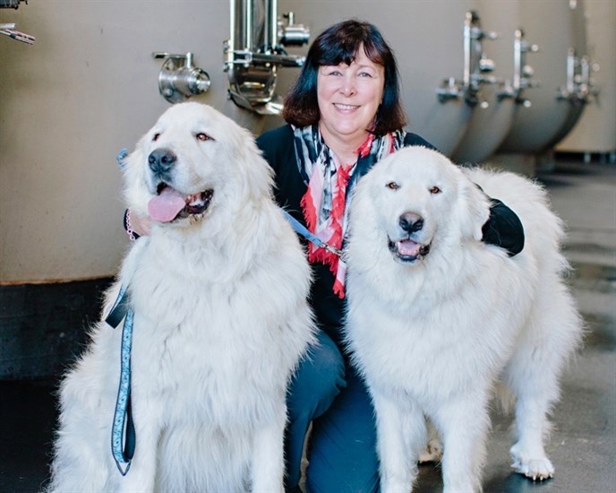 Christine with her two Great White Pyrenees dogs Bizou and Yukon.