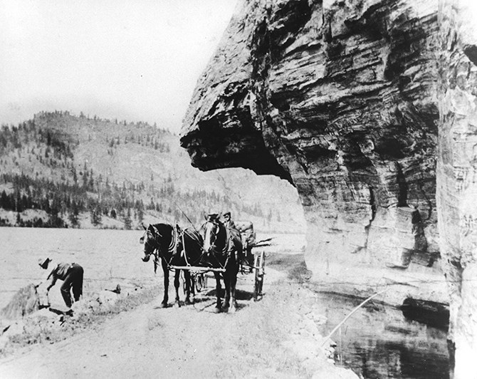 The rock overhang was a popular stop for a photograph while on Highway 97 even during the horse and buggy era. The photographer and date of the photo is unknown.