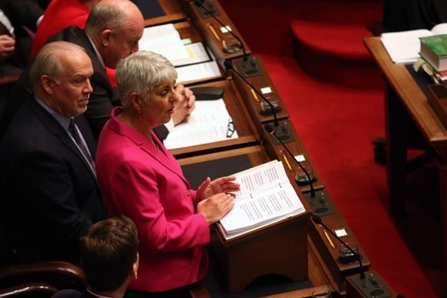 Minister of Finance Carole James delivers the budget speech from the legislative assembly at B.C. Legislature in Victoria, B.C., on Tuesday, February 18, 2020.
