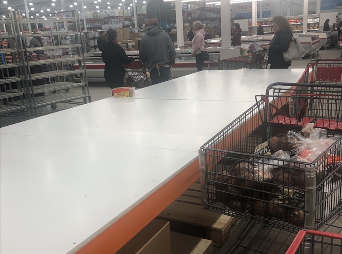 Costco shelves were emptied this week as panic buying reached a fever pitch.