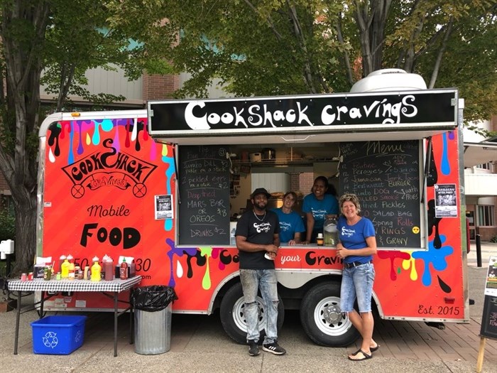 Owner Deanna Bell with her employees outside the Cookshack Cravings truck.