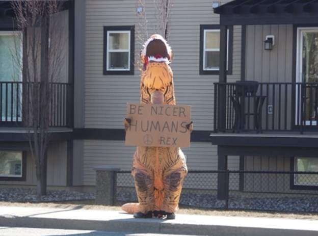 The dinosaur switched signs to encourage humans to be nicer.