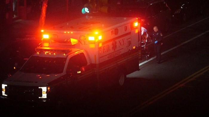 In this Thursday, April 2, 2020, image made from video, a person is taken into an ambulance in the Brooklyn borough of New York. The sounds of sirens can be heard prominently in the city, where the number of deaths due to the new coronavirus continues to climb.