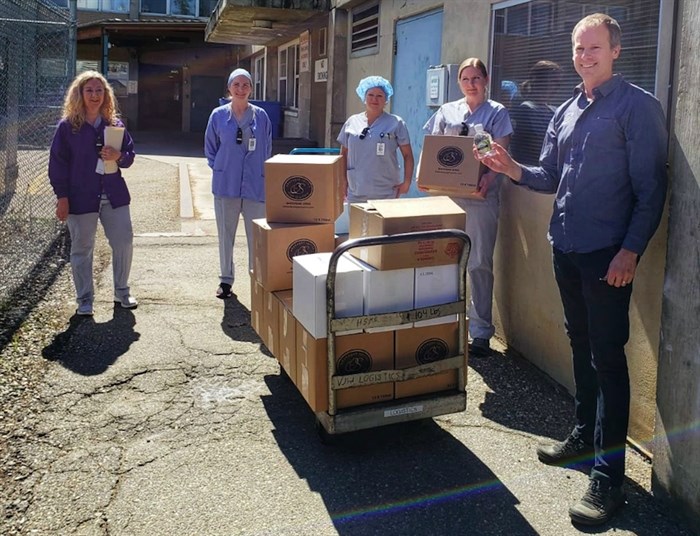 Staff at Vernon Jubilee Hospital receive a shipment of hand sanitizer from Okanagan Spirits Craft Distillery.