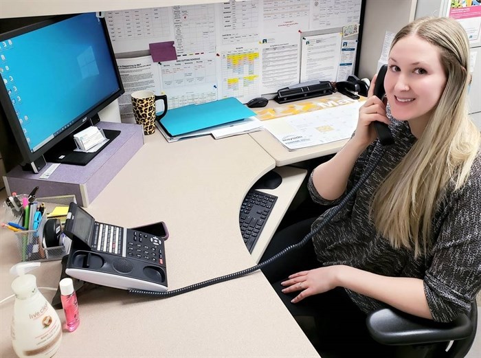 Canadian Mental Health Association intake coordinator Megan Cranton is seen conducting daily check-ins with community members by phone in this undated photo.