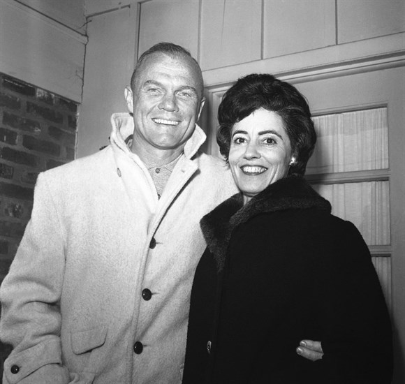 In this Feb. 3, 1962 file photo, astronaut John Glenn poses with his wife, Annie, outside their Arlington, Va., home during his first news conference. Glenn, the widow of astronaut and U.S. Sen. John Glenn and a communication disorders advocate, died Tuesday, May 19, 2020, of COVID-19 complications at a nursing home near St. Paul, Minn., at age 100.