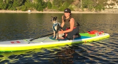 Devin Selwood and her rescue dog Ruka enjoy a relaxing day on the water with their stand-up paddleboard from Sun n’ Sup in Naramata