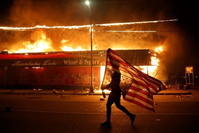 AMERICAN UNREST Minneapolis police station torched as 