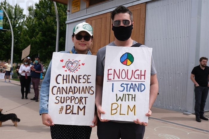 Winni and Cameron McIntosh created signs to show their support for the Black Lives Matter movement during a protest in Kelowna, June 5.