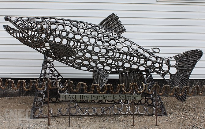 The 10 foot long sculpture is made entirely of used horseshoes.