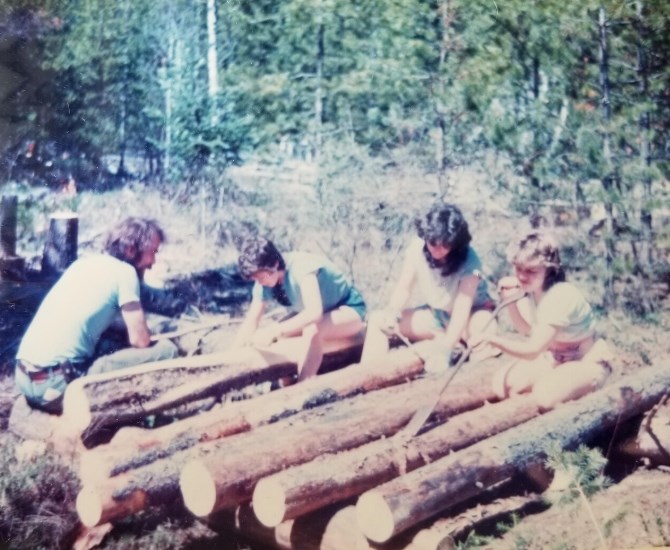 Volunteers stripping logs to build a playground at Stocks Meadow, 1986.