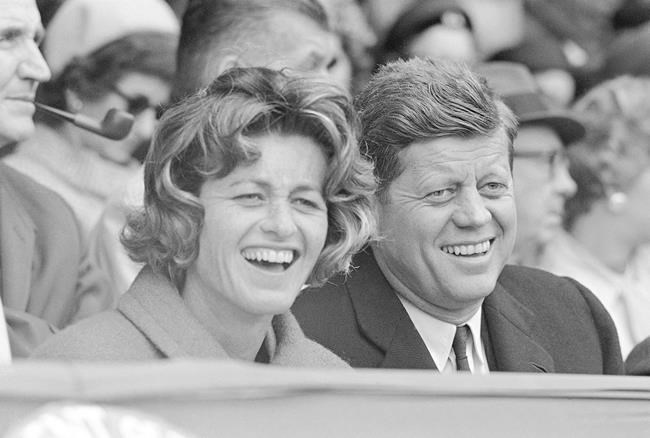 FILE - In this April 10, 1961, file photo, President John F. Kennedy and his sister, Jean Kennedy Smith, watch an opening day baseball game at Griffith Stadium in Washington. Jean Kennedy Smith, the youngest sister and last surviving sibling of President John F. Kennedy, died at 92, her daughter confirmed to the New York Times. Smith died Wednesday, June 17, 2020, at her Manhattan home, her daughter Kym told the Times. 