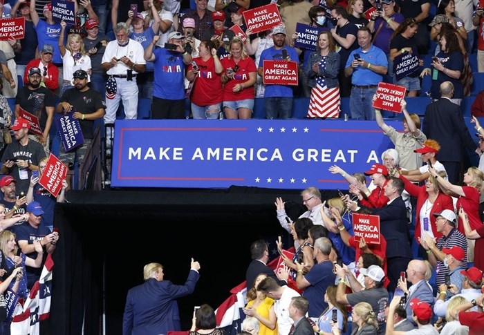 President Donald Trump gives a thumbs-up to the crowd at the BOK Center after his first re-election rally in Tulsa, Okla., Saturday, June 20, 2020. 