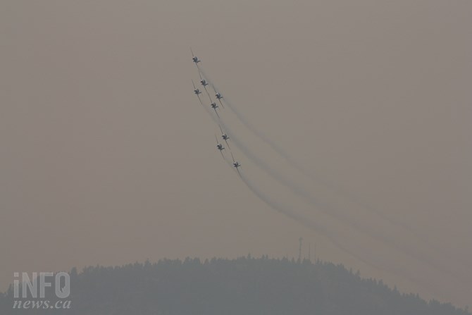 FILE PHOTO- A smoky sky performance of the Canadian Forces Snowbirds over Penticton in early August, 2017.